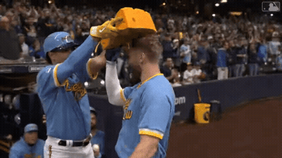 Baseball Player In Blue Jersey And Yellow Hat GIF