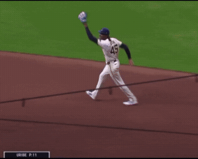 Baseball Player In Blue Jersey Number 45 GIF
