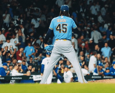 Baseball Player In Blue Jersey Number 45 GIF