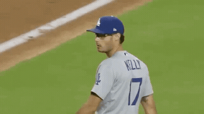 Baseball Player In Blue Jersey Number 7 GIF