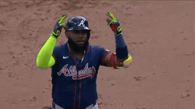 Baseball Player In Blue Jersey Shaking Hands GIF