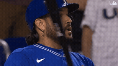 Baseball Player In Blue Jersey With Letter U GIF