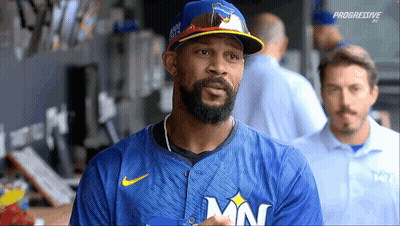 Baseball Player In Blue Jersey With MN GIF