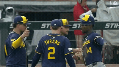 Baseball Player In Blue Uniform Swinging Bat GIF