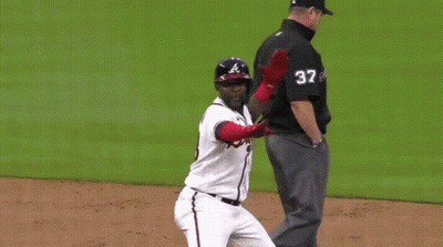 Baseball Player In Braves Jersey Standing On Field GIF