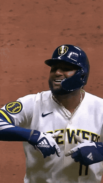 Baseball Player in Brewers Jersey Pointing