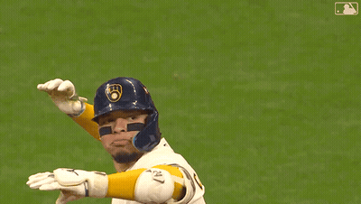 Baseball Player in Brewers Jersey Standing on Field