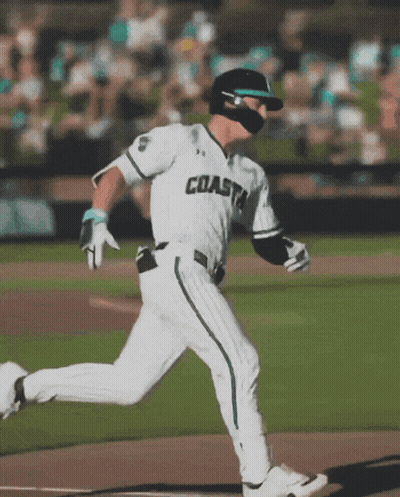 Baseball Player in Coast Uniform Running to Home Plate