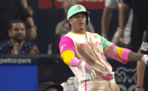 Baseball Player In Colorful Jersey And Green Hat GIF