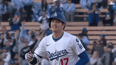 Baseball Player In Dodgers Uniform Standing On Field GIF