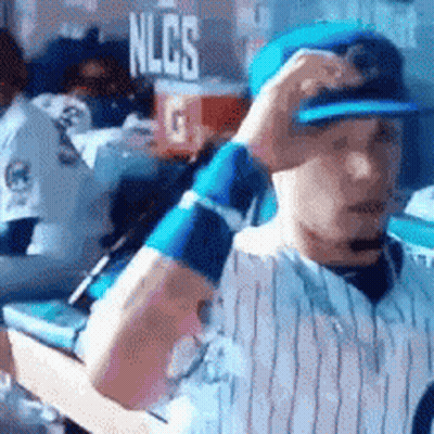 Baseball Player In Dugout With NLCS Sign GIF