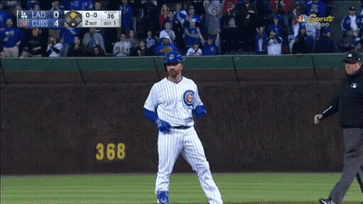 Baseball Player In Front Of Cubs Scoreboard GIF