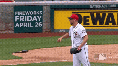 Baseball Player In Front Of Fireworks Sign GIF