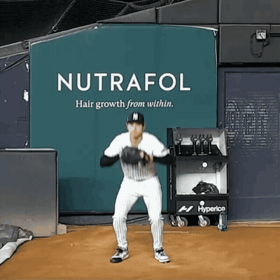 Baseball Player In Front Of Nutrafol Sign GIF