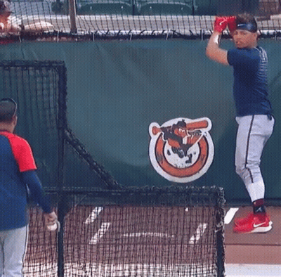 Baseball Player In Front Of Orioles Logo GIF