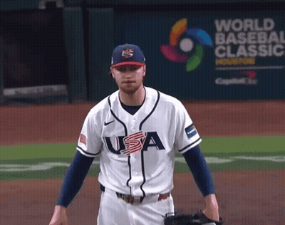 Baseball Player In Front Of World Banner GIF