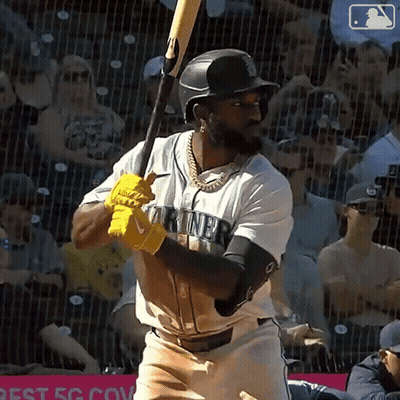 Baseball Player In Mariners Jersey Swinging Bat GIF