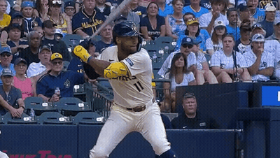 Baseball Player In Milwaukee Jersey Swinging Bat GIF