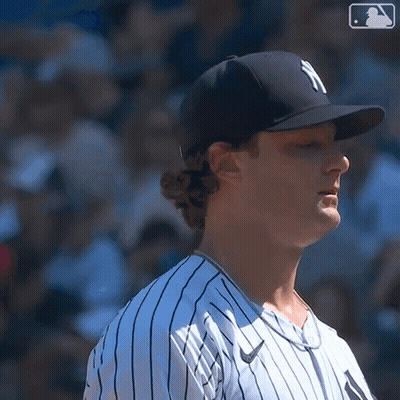 Baseball Player In NY Hat And Striped Shirt GIF