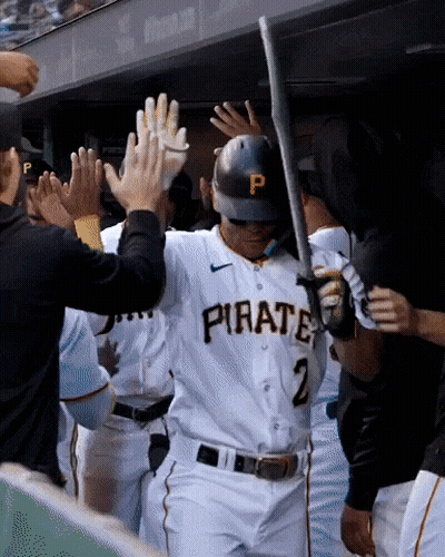 Baseball Player in Pirate Jersey High Fived