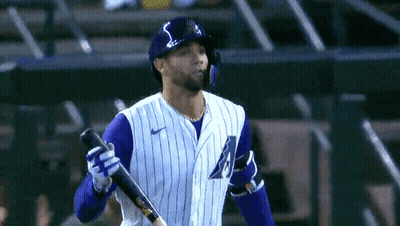 Baseball Player In Purple And White Striped Uniform Holding Bat GIF