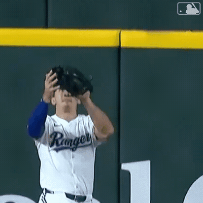 Baseball Player In Rangers Uniform Catching Ball GIF