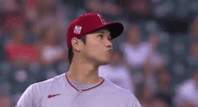 Baseball Player In Red Hat And White Shirt GIF