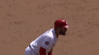 Baseball Player In Red Helmet Gloves Swinging Bat GIF
