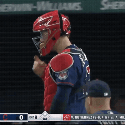 Baseball Player In Red Helmet In Front Of Scoreboard GIF