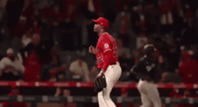 Baseball Player In Red Uniform Number 32 GIF