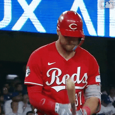 Baseball Player In Reds Jersey Holding Bat GIF
