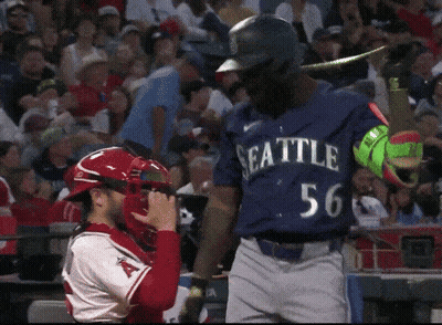Baseball Player In Seattle Uniform Standing In Front Of Catcher GIF