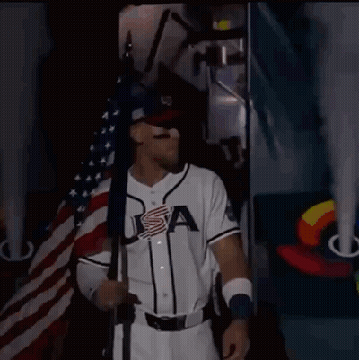 Baseball Player In USA Jersey Holding Flag GIF