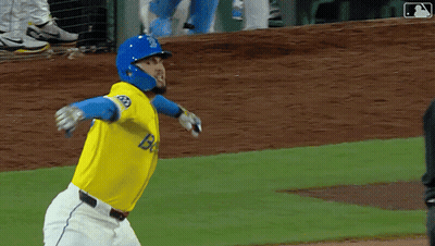 Baseball Player In Yellow And Blue Uniform With Letter B GIF