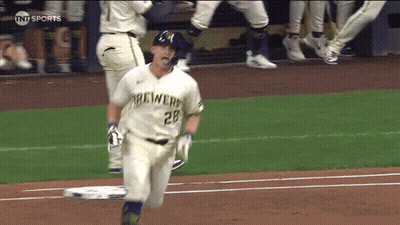 Baseball Player in Yellow Helmet and Blue Jersey Smiling and Waving