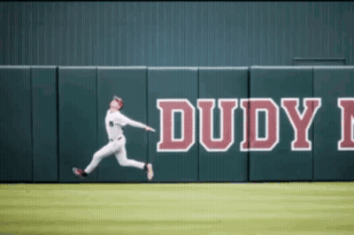 Baseball Player Jumps For Ball Near Dudy Wall GIF