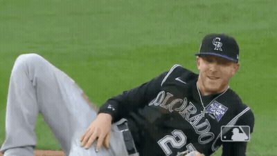 Baseball Player Laying On Field With Legs Crossed GIF