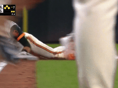 Baseball Player Laying On Ground With Scoreboard Saying 7 GIF