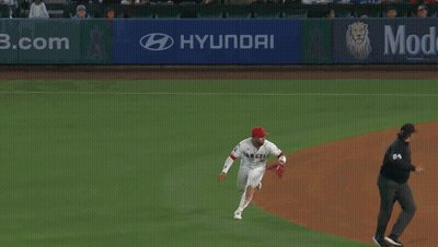 Baseball Player Laying On Ground With Scoreboard Saying Mid Eighth GIF