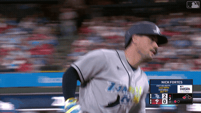 Baseball Player Nick Fortes Behind Him