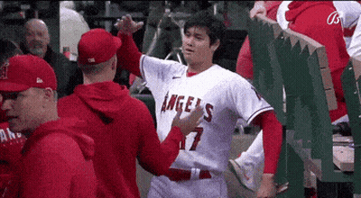 Baseball Player Number 17 Hugged By Teammate GIF