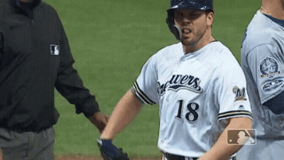 Baseball Player Number 18 Talks to Umpire