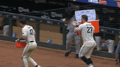 Baseball Player Number 27 Running Towards Another GIF