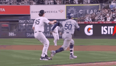 Baseball Player Number 50 Running Toward Another Player GIF