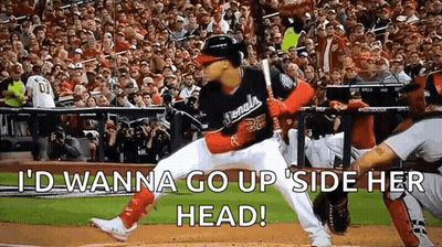 Baseball Player Ready To Hit Ball As Crowd Watches GIF