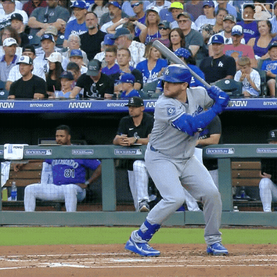 Baseball Player Ready To Swing Bat In Front Of Arrow Ad GIF