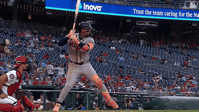 Baseball Player Ready To Swing In Front Of Inova Sign GIF
