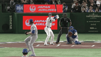 Baseball Player Ready To Swing In Front Of Japan Airlines Ad GIF