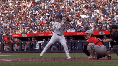 Baseball Player Ready To Swing With Blue Cross For Punch Banner GIF