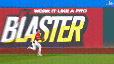 Baseball Player Running In Front Of Blaster Sign GIF